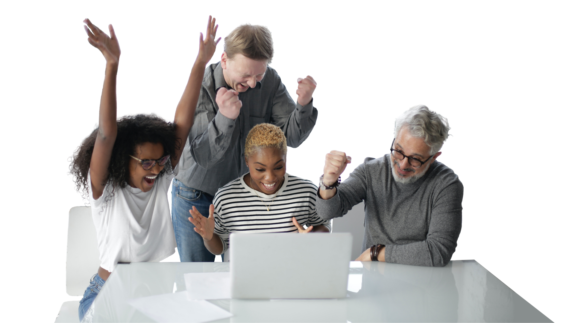 Two women and two men in front of a laptop cheer and celebrate a success